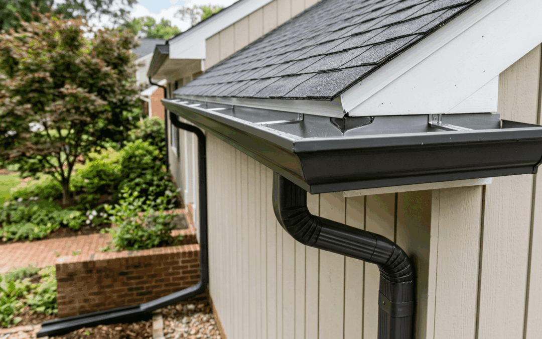 The side of a home showing professional gutters installation.